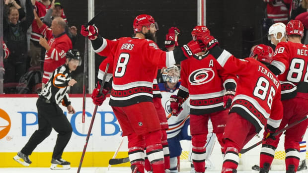 Nov 10, 2022; Raleigh, North Carolina, USA; Carolina Hurricanes center Martin Necas (88) celebrates his goal with center Martin Necas (88) and center Sebastian Aho (20) against the Edmonton Oilers during the second period at PNC Arena. Mandatory Credit: James Guillory-USA TODAY Sports